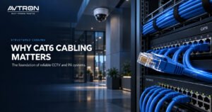 CAT6 cables connected to network switches in a structured cabling setup, supporting reliable CCTV and PA system connectivity.